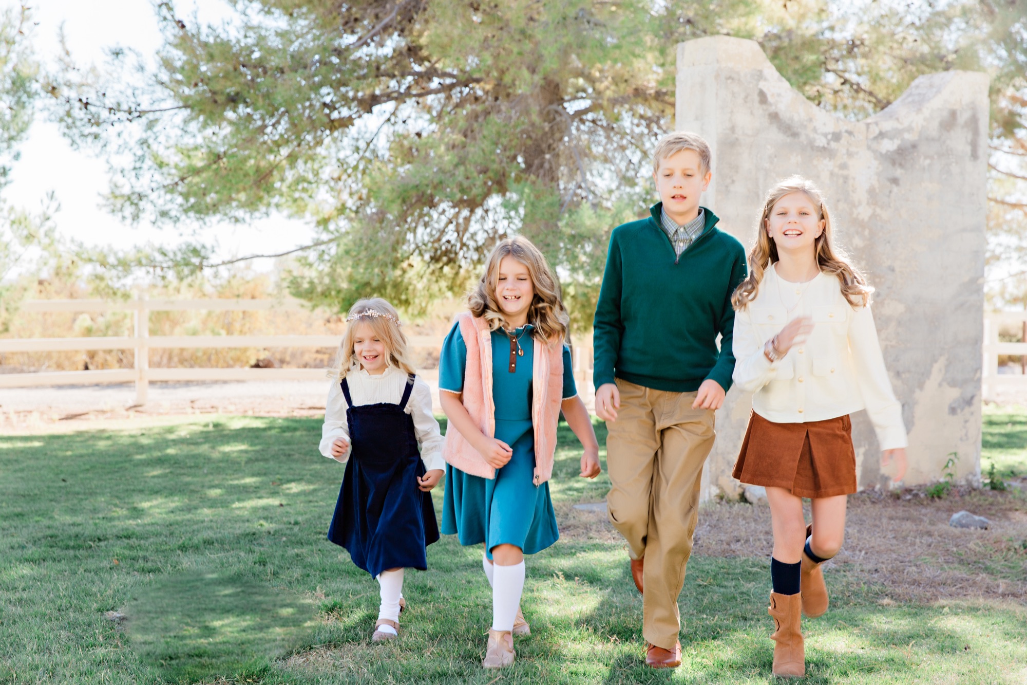 Kids running in coordinated outfits at the park