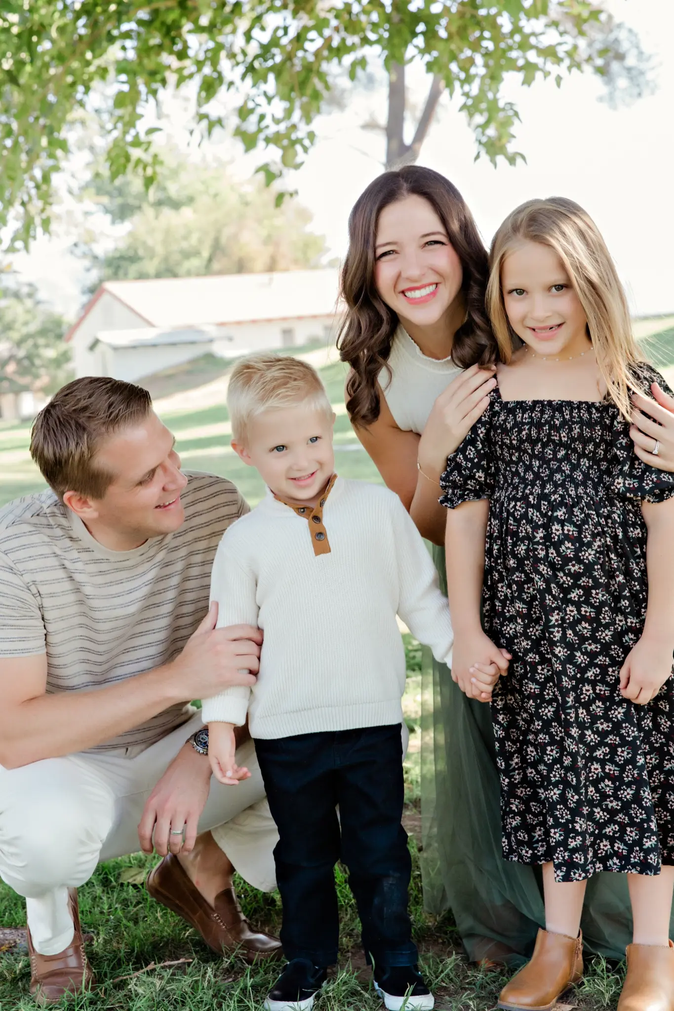 Family of four in sage and cream at the park