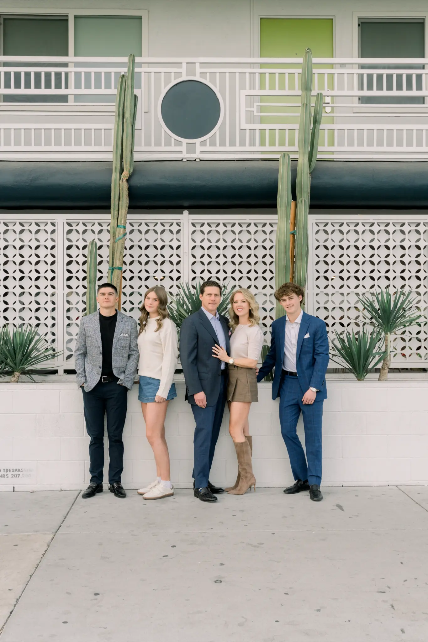 Family in navy suits and elevated neutrals, urban setting